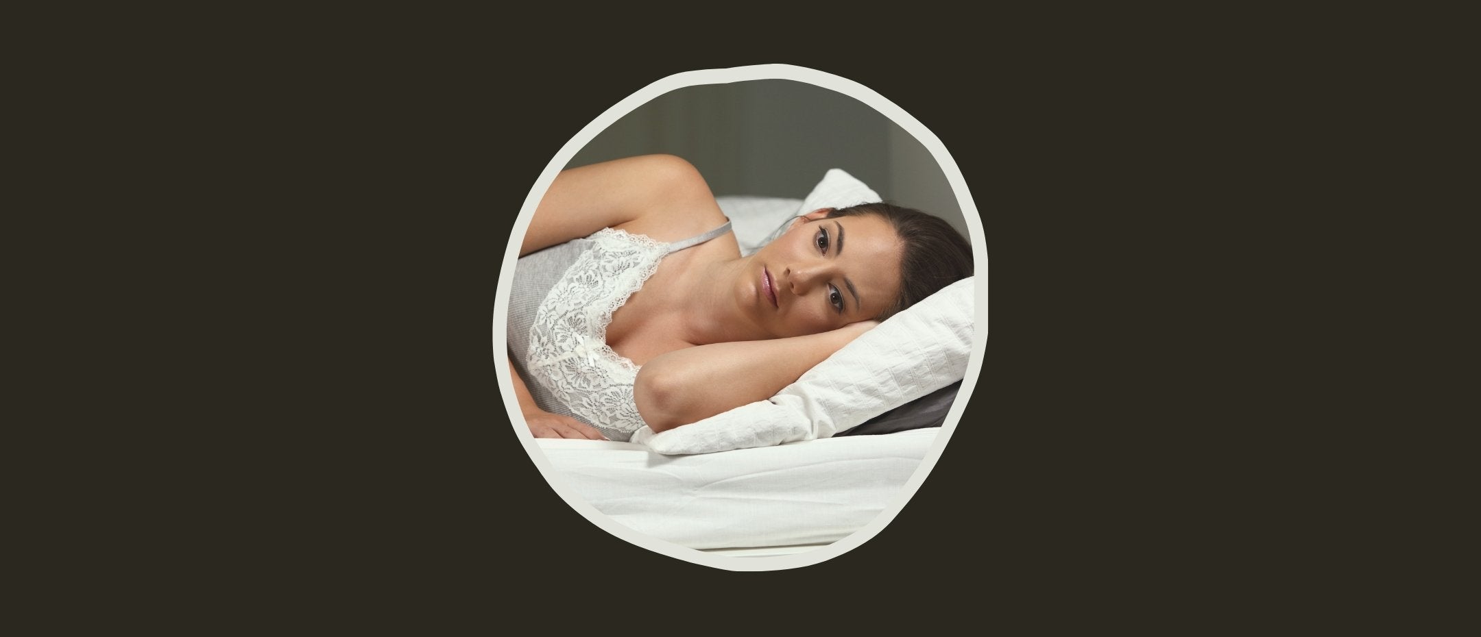 Woman suffering from insomnia in bed