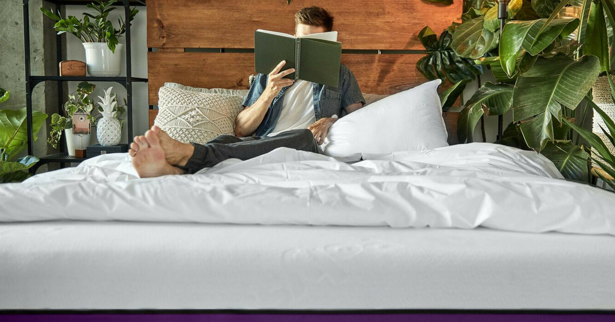 man reading his book on the Polysleep mattress