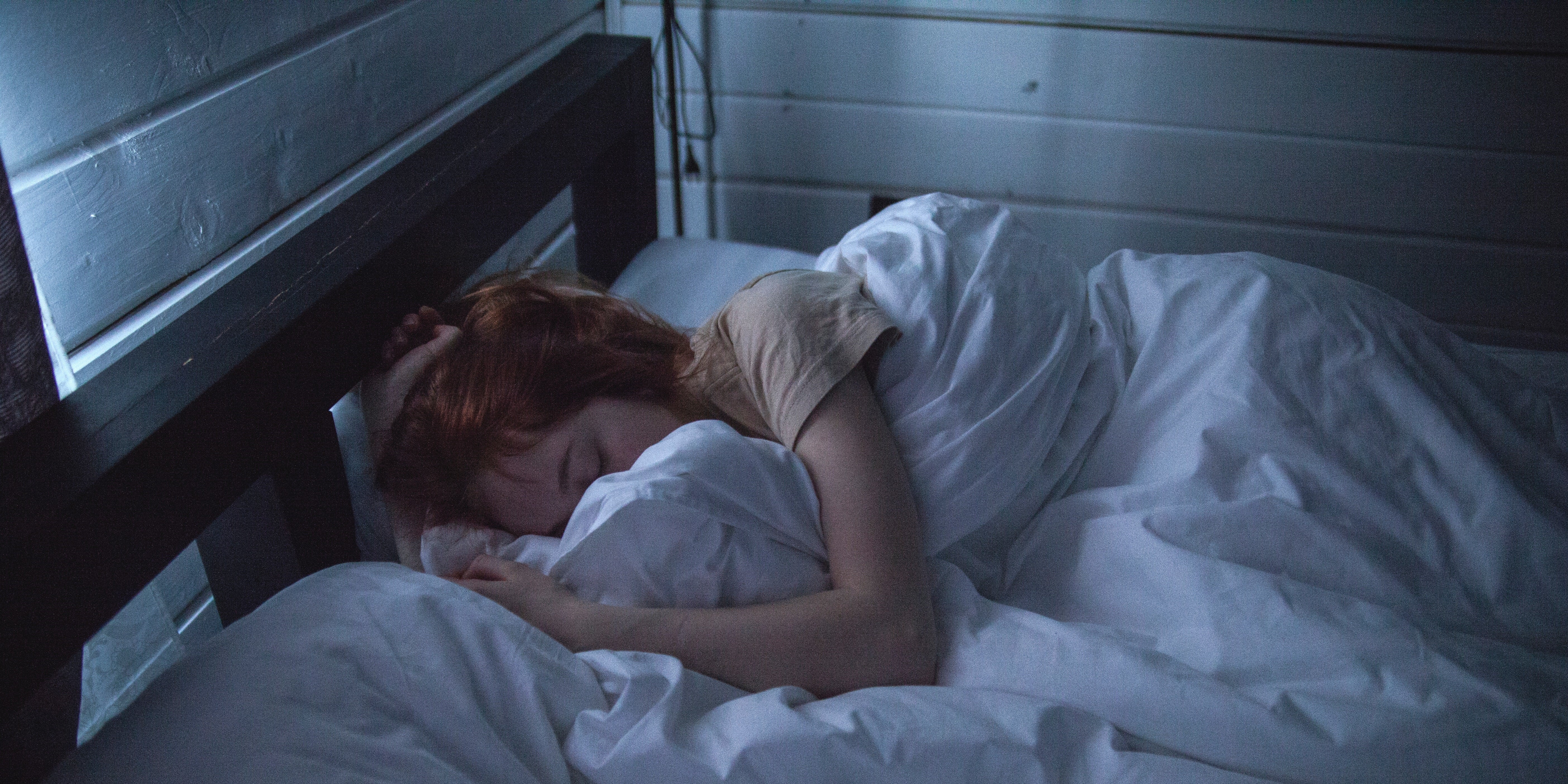 Woman sleeping with a cold